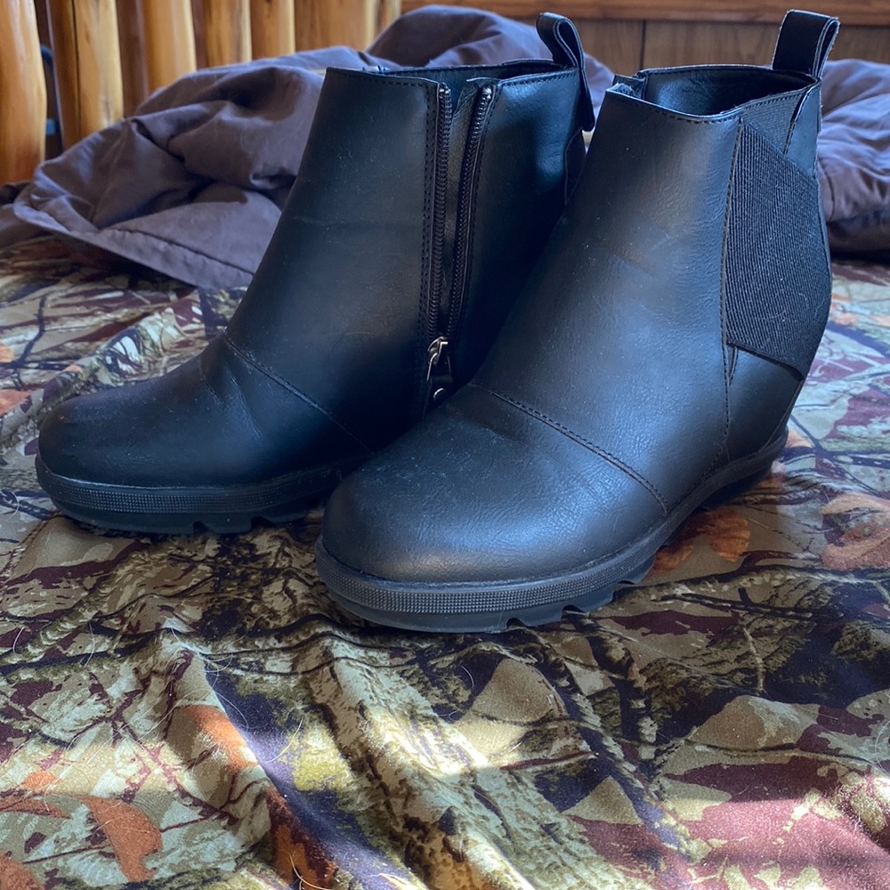Woman’s hidden wedge boots, black leather, worn once. Size 7.